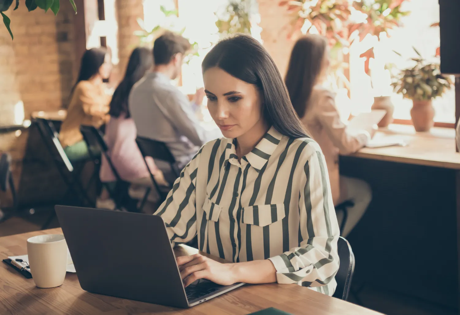 Woman working on laptop SEO of website